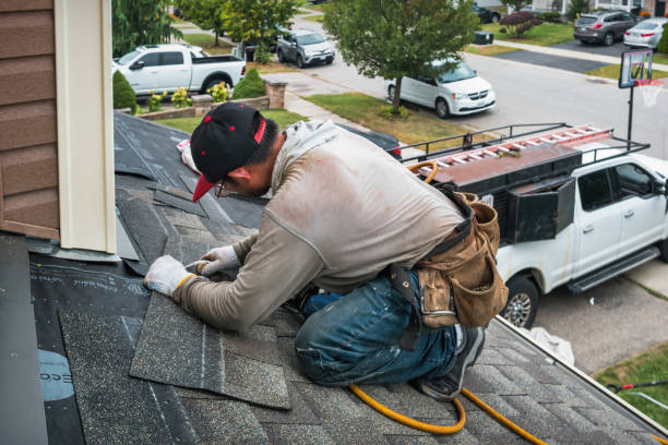 Professional Gutter Repair And Installation technician working in Galveston, IN